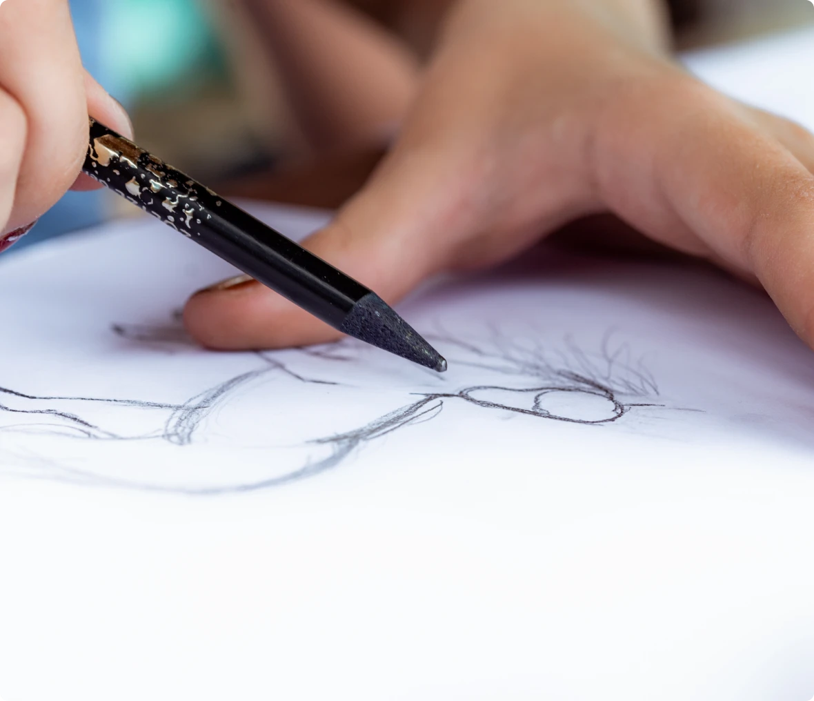 Close-up of drawing hand and pencil