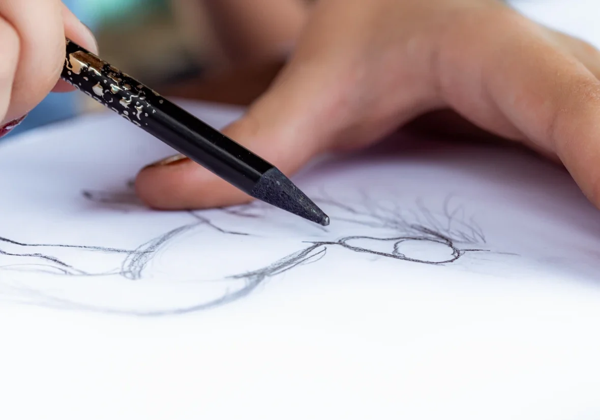 Close-up of drawing hand and pencil